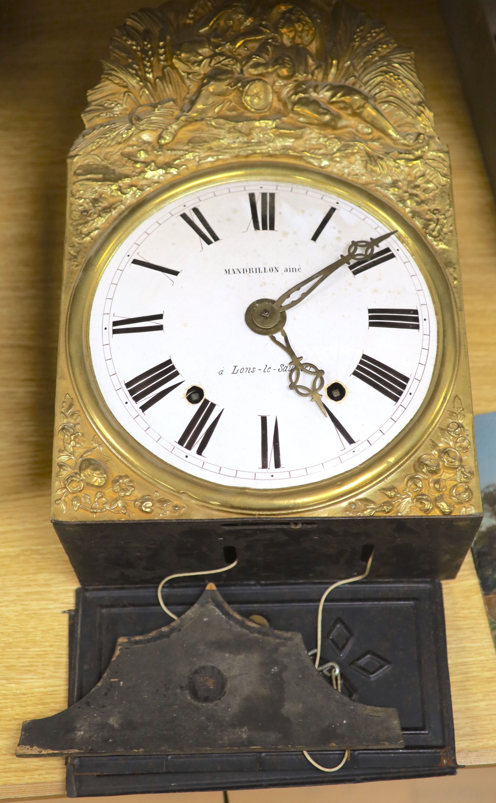 A 19th century French embossed brass wall clock, height 42cm